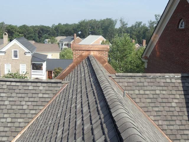 Residential roof with new gray shingles and bronze flashing installed by Lewis and Son Roofing